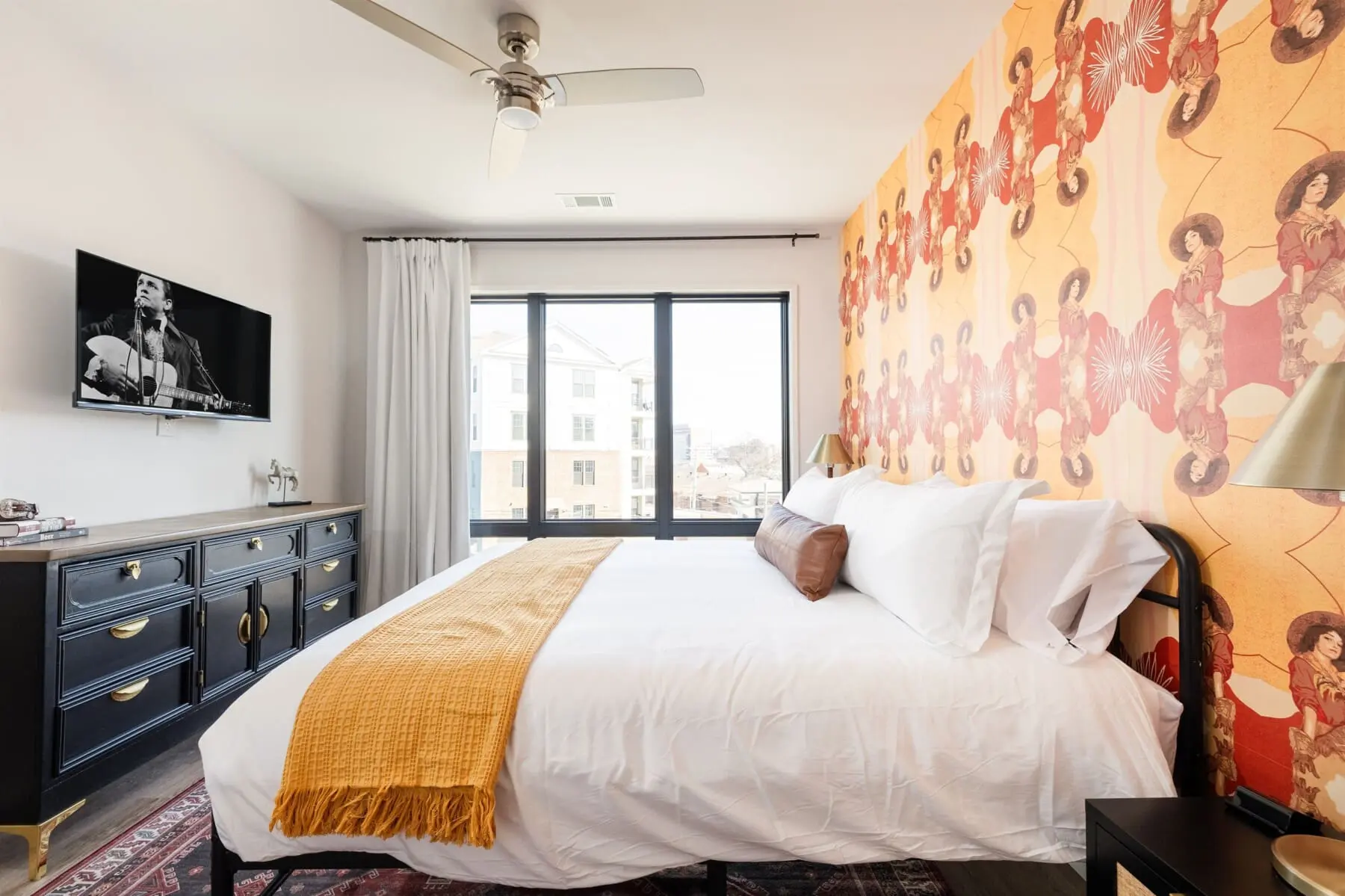 Honky Tonk Party Pad 1 primary bedroom Mae West wallpaper Nashville vacation rental Music City Magnolia