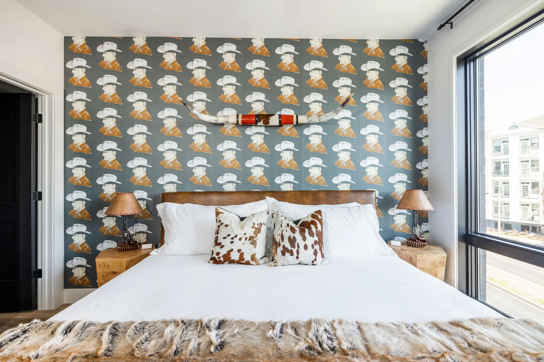 Honky Tonk Party Pad 2 primary bedroom leather platform bed bull horns Nashville vacation rental