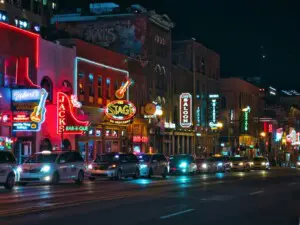Lower Broadway in Nashville lit up with neon honky tonk signs at night