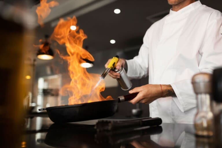 Music City Magnolia Nashville vacation rental - side view man cooking job scaled 1.jpg