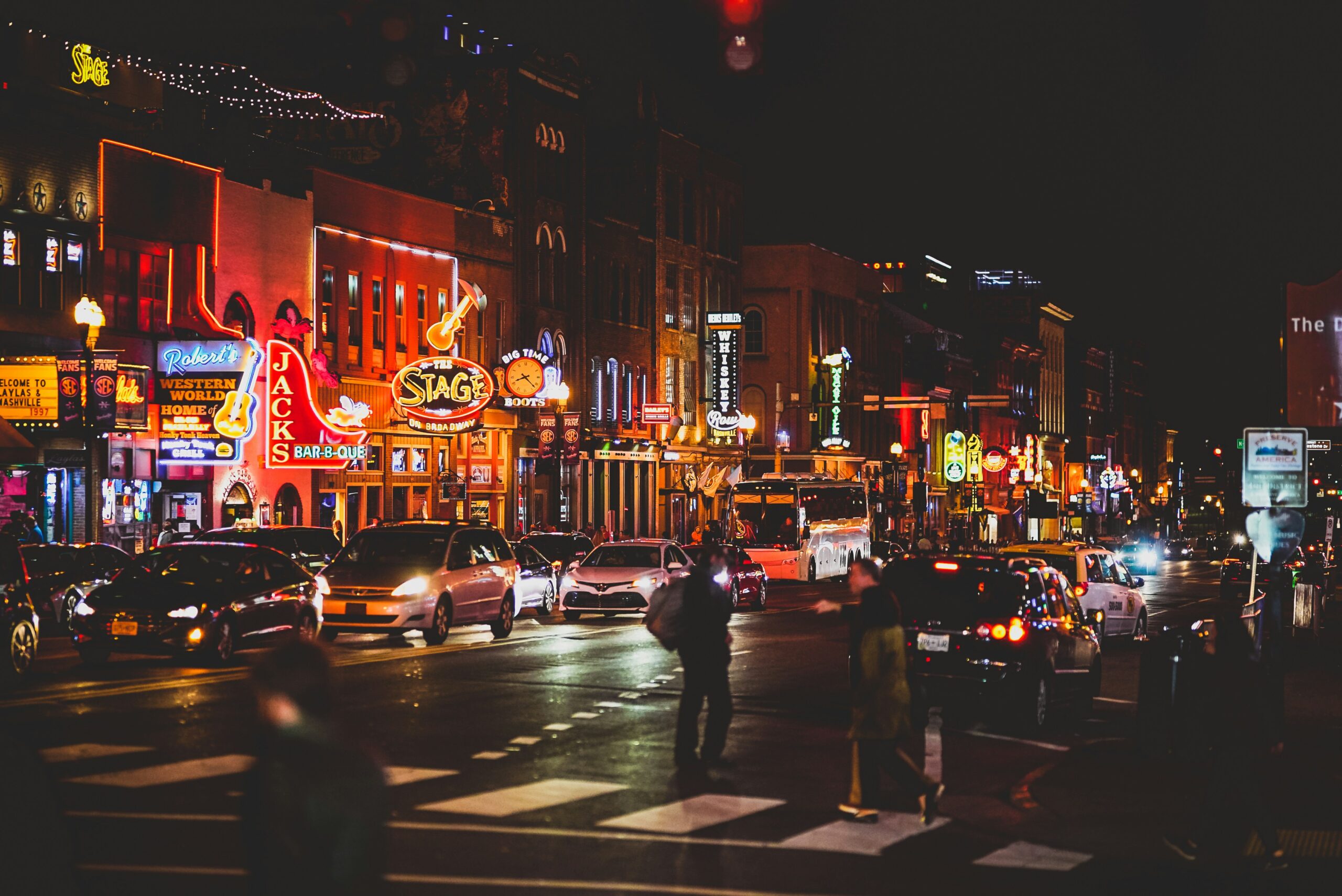 Nashville Broadway at night — neon signs, Robert's Western World, The Stage on Broadway