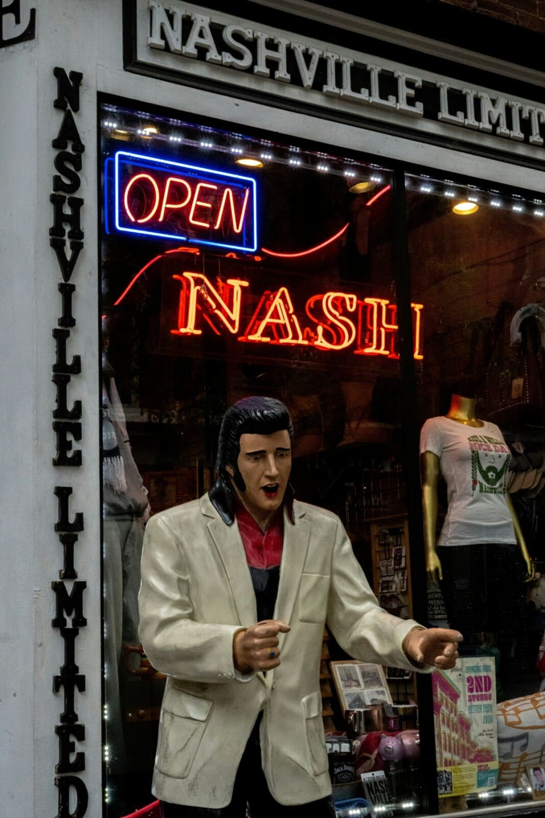 Nashville Broadway street scene with pedestrians and neon signs near the Rock n Roll Marathon start line