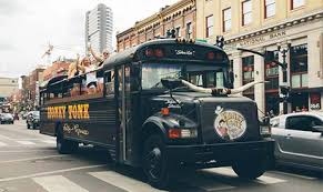 Honky Tonk Party Express covered party bus on Broadway Nashville