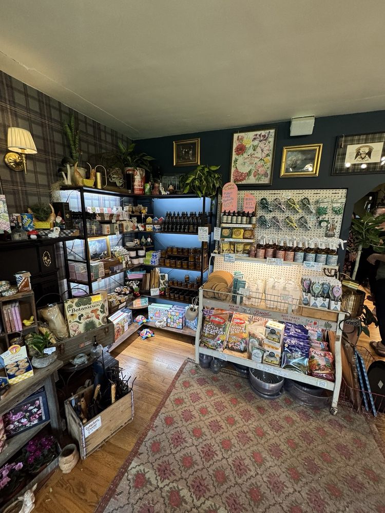 Lawrence & Clarke Cacti Co. interior in Donelson — pegboard with plant tools, botanical prints