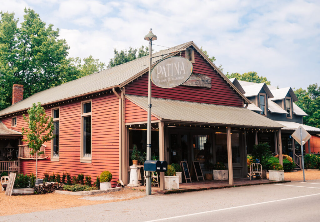 Patina Home & Garden storefront in Leiper’s Fork, TN — red barn building on Old Hillsboro Rd