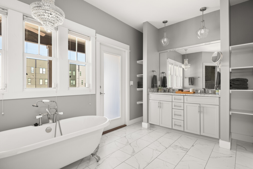 Primary Ensuite Clawfoot Soaking Tub, Plush Linens & Forgot-Its (Upstairs) — Cumberland Retreat, Music City Magnolia East Nashville rental near Nissan Stadium